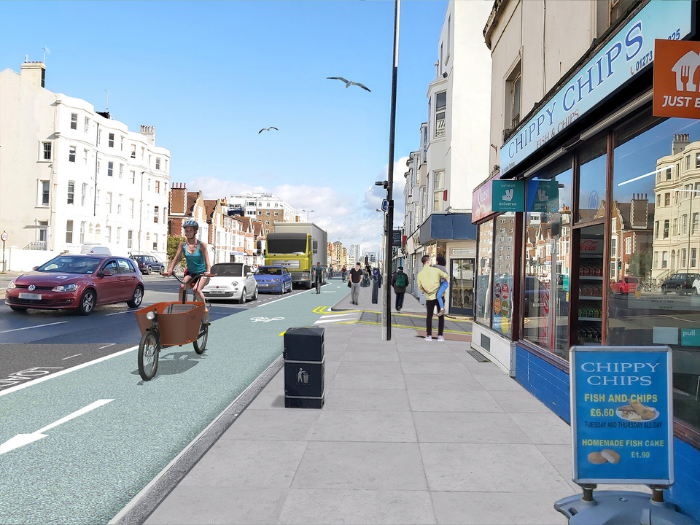 "an artist image of a pavement with a cycle lane next to it with an image of a person on a large bike"