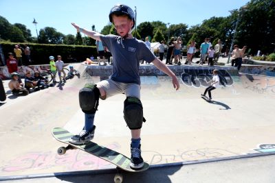 Young boy skate boarding at The Level Skatepark