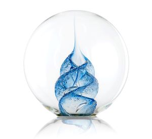 "glass paperweight with blue swirled pattern in the middle"