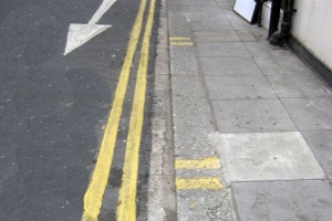 double yellow lines with yellow kerb markings