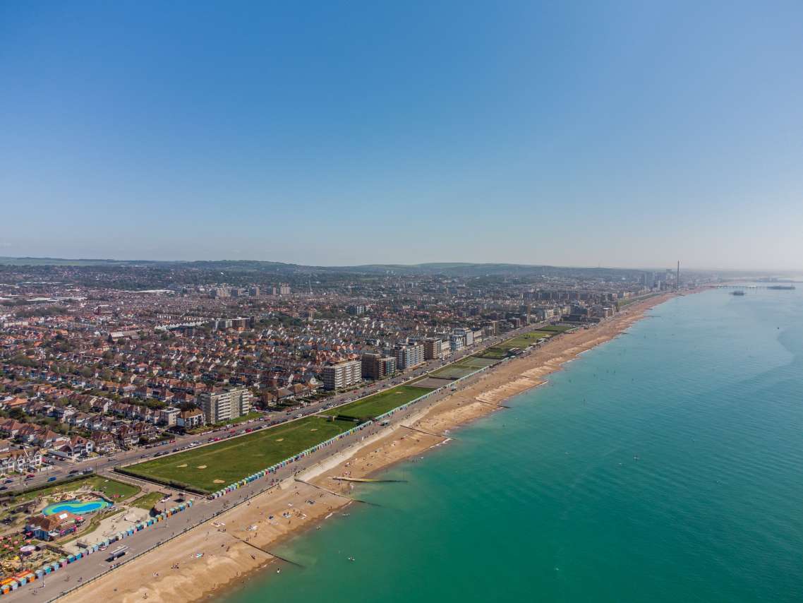 Aerial view from the south-west beside Hove Lagoon looking along the Seafront towards the city centre - across the Esplanade, Western Lawns, Kingsway and West Hove