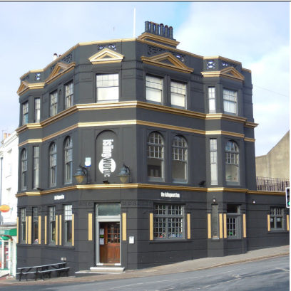 Image of The Islington Inn. A large black building with golden accents.