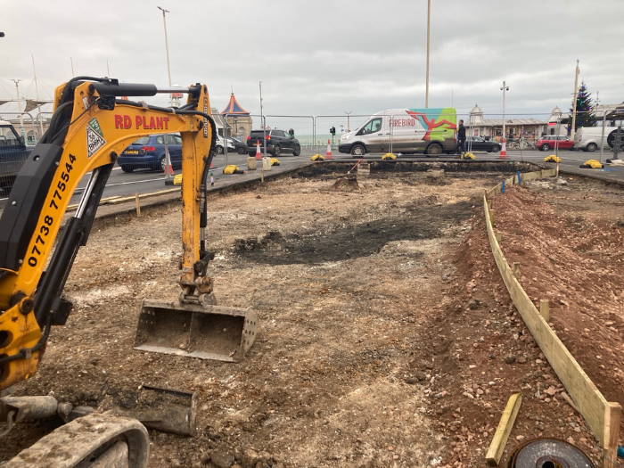 A picture of some large machinery digging up a road