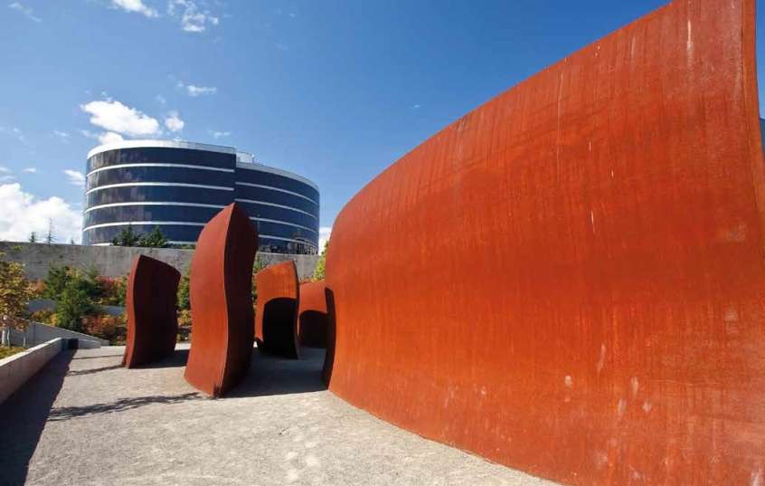 Abstract rust-coloured sculptures like waves