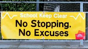 No Stopping No Excuses sign outside a local school