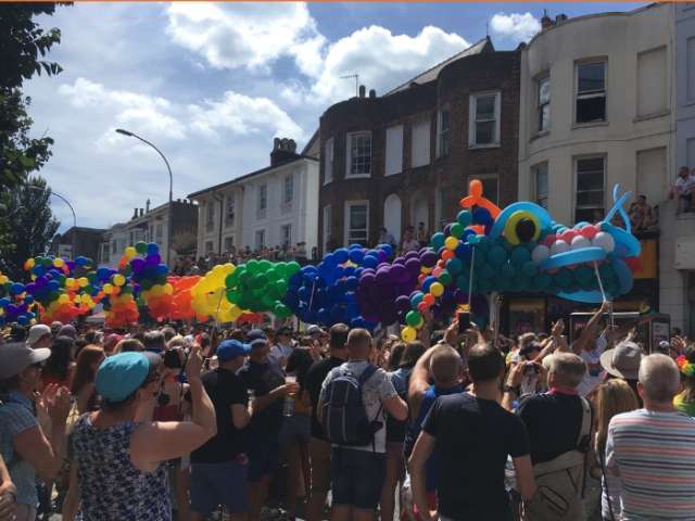 Pride street parade with dragon