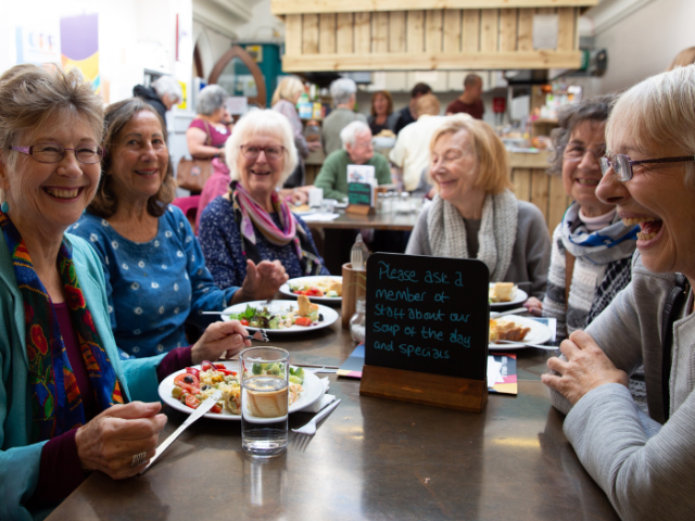 Women eating lunch at the Older People's Festival - photo by Maria Scard