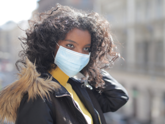 Woman wearing a white face mask