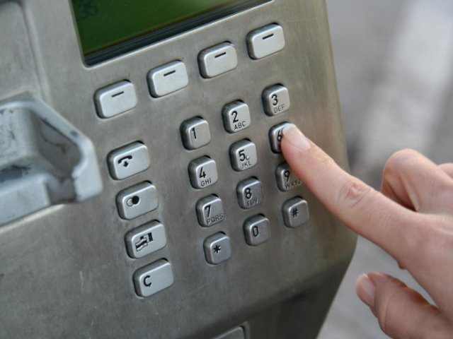 Payphone dialling pad inside a phone box