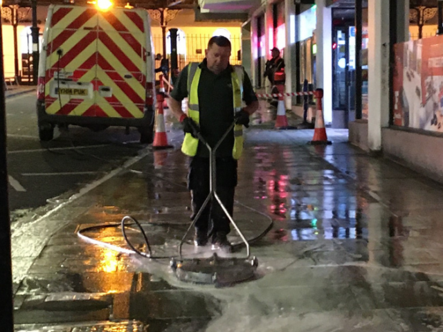 image of street being jet washed