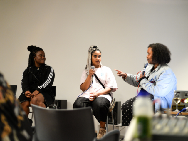 Three women sitting down and talking at an arts event at the Lighthouse venue; photo courtesy of Last Dance @ Lighthouse