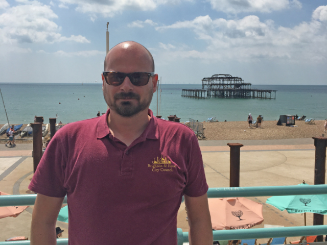 Field officer Tom Hicks on Brighton seafront.