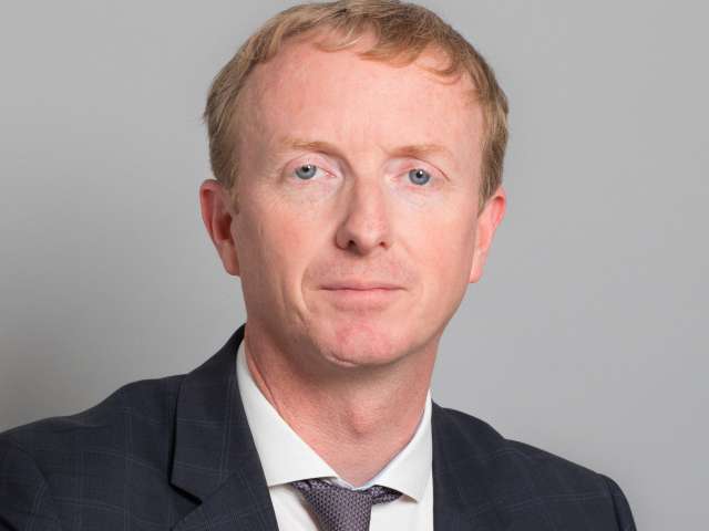 Head and shoulders photograph of Nick Hibberd