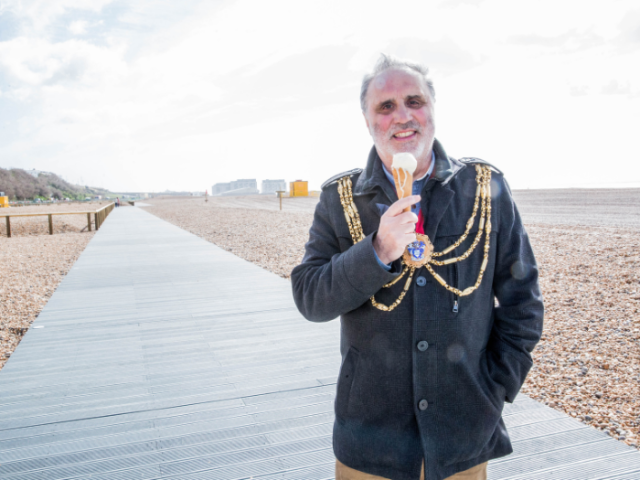 Picture of city Mayor Alan Robins enjoying an ice cream on the new boardwalk at Black Rock