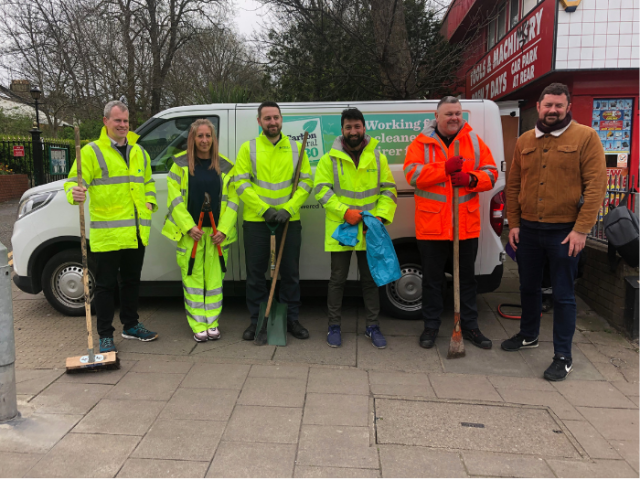 People in Hi Viz vests looking happy waiting to start their litter pick