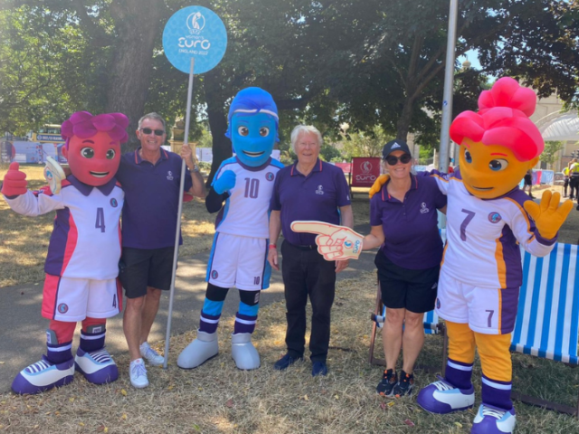 Picture of UEFA Women's EURO 2022 volunteers with the tournament mascots