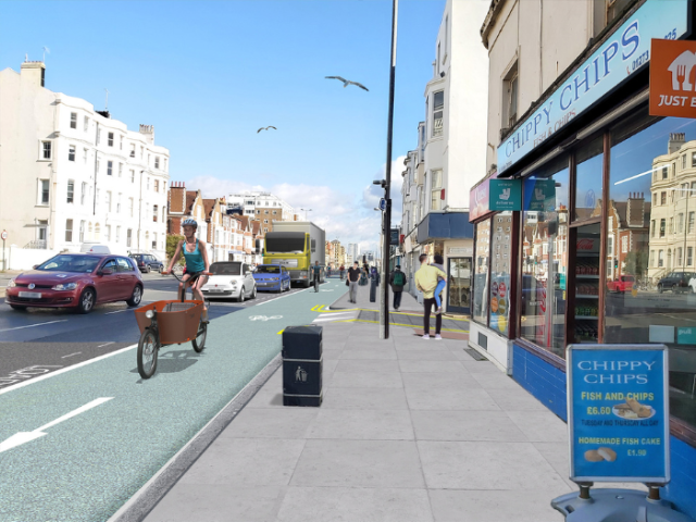An computer generated image of a road with cycle lane and shops