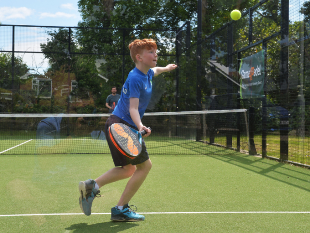 Young padel player in action