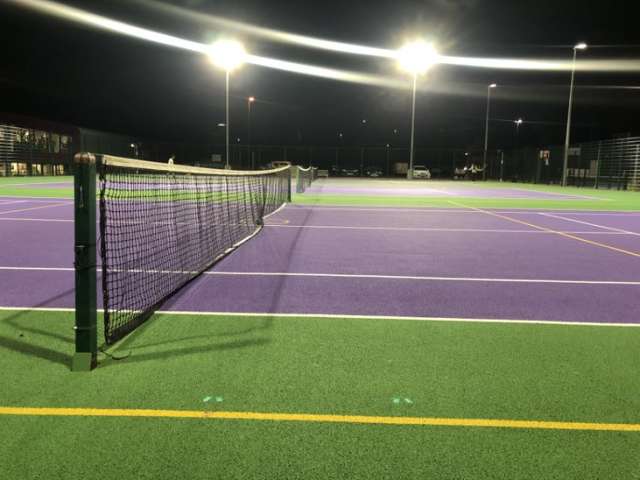 LED energy-efficient lighting lighting up a tennis court at Withdean sports stadium