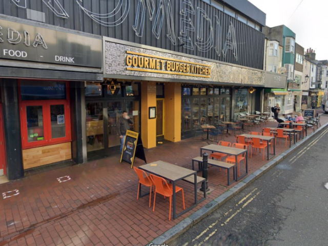 Shops with tables and chairs outside