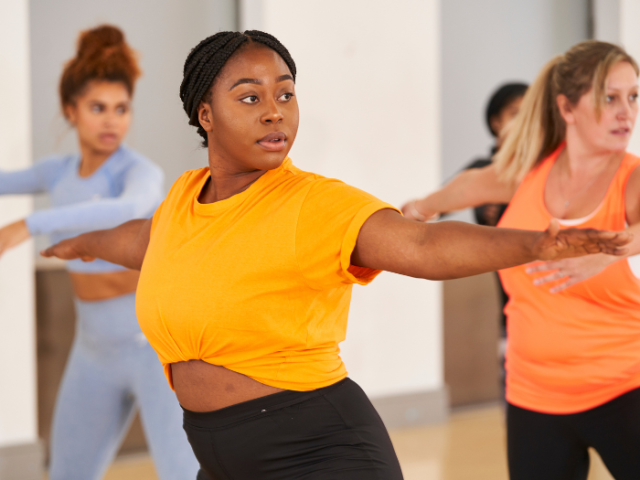 Three women exercising.