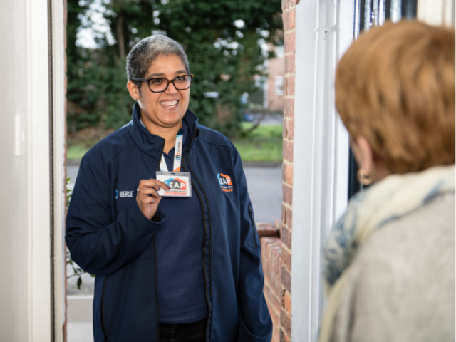 An advisor from the Local Energy Advice Partnership meeting a resident