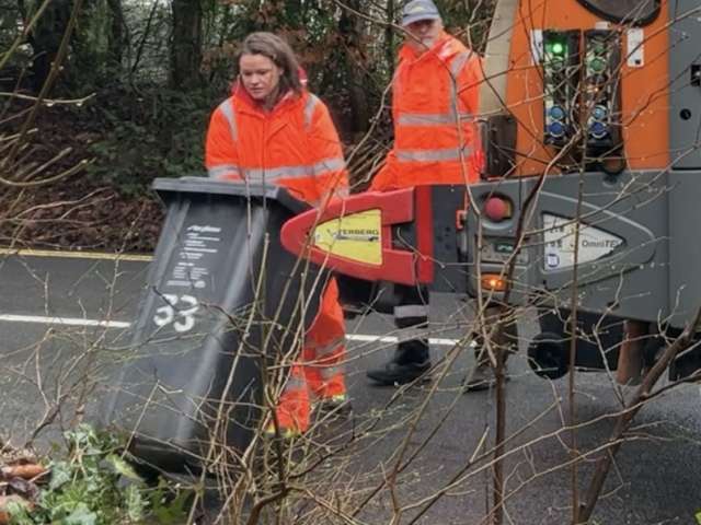 Image shows Brighton & Hove City Council leader Bella Sankey spending a shift with the council's recycling team and emptying bins