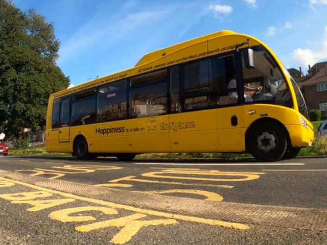 A picture of a yellow bus