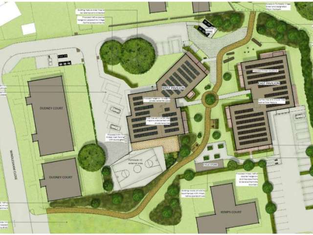 An overhead illustration of the planned site shpwing the new and existing buildings in grey, with a green walking route through the site shown.