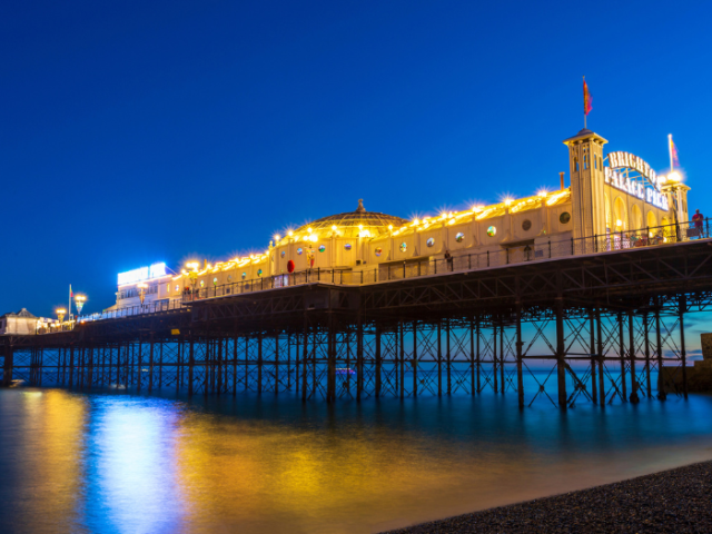 Palace Pier lit up at night