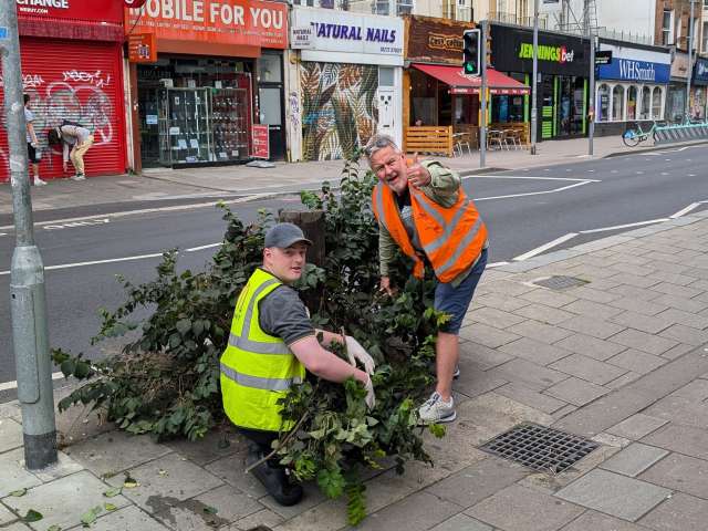 Councillor Ty Goddard and a volunteer taking part in the Open Market tidy up