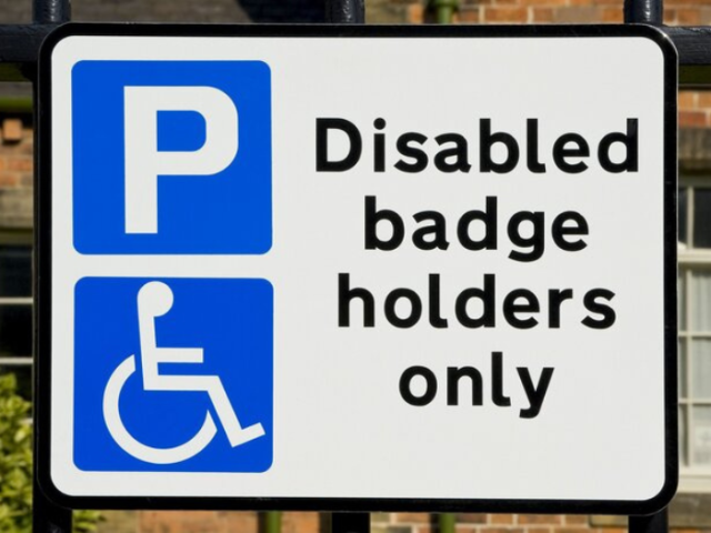 A picture of a blue badge sign