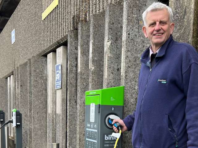 Councillor Trevor Muten charging up at a point outside Norton Road car park in Hove