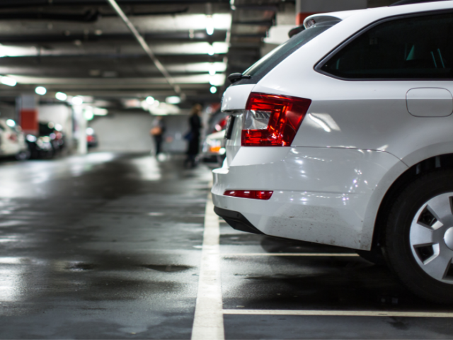 white car in a car park.