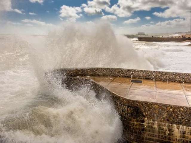 Waves hitting sea defences outside the Marina in Brighton