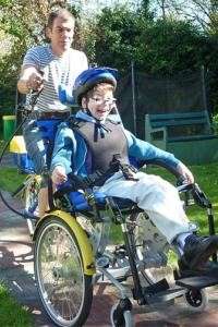 Photograph of a child in a wheelchair