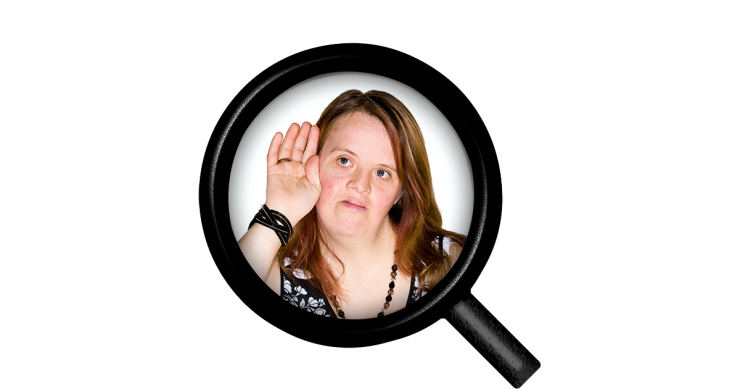 A person with their hand behind their ear showing they are listening.