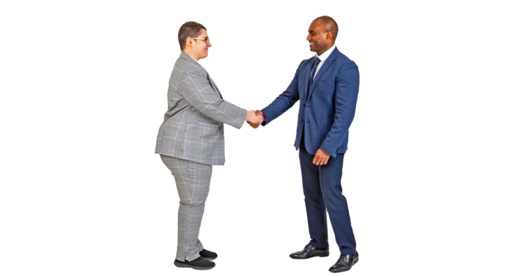 2 people dressed in suits shaking hands.