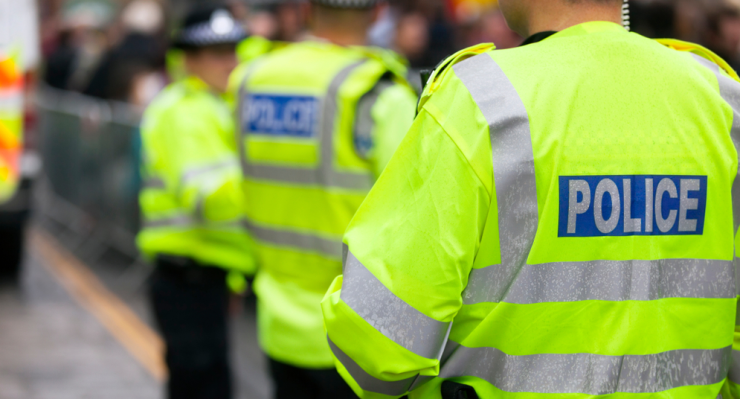 British police in uniform on the street.