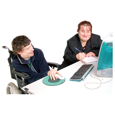 Photograph of two people using a computer, one person is in a wheelchair