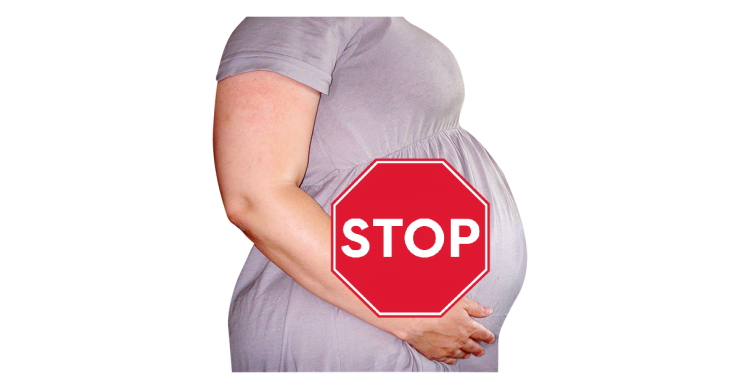 Pregnant person with 'Stop' sign over the top.