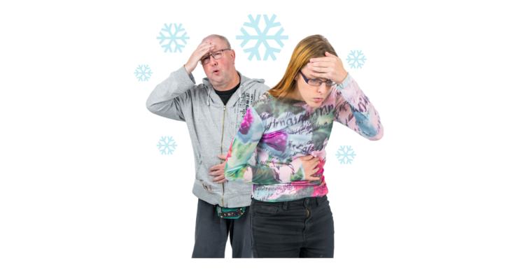 2 people with their hands on their stomach and head looking in discomfort. There are snowflakes around them.